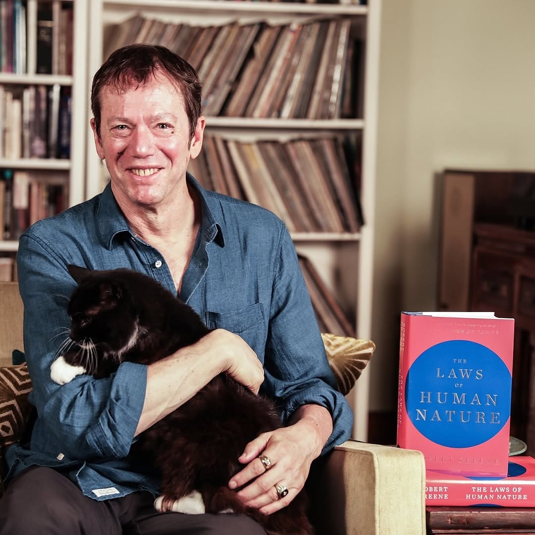 robert greene holding a cat