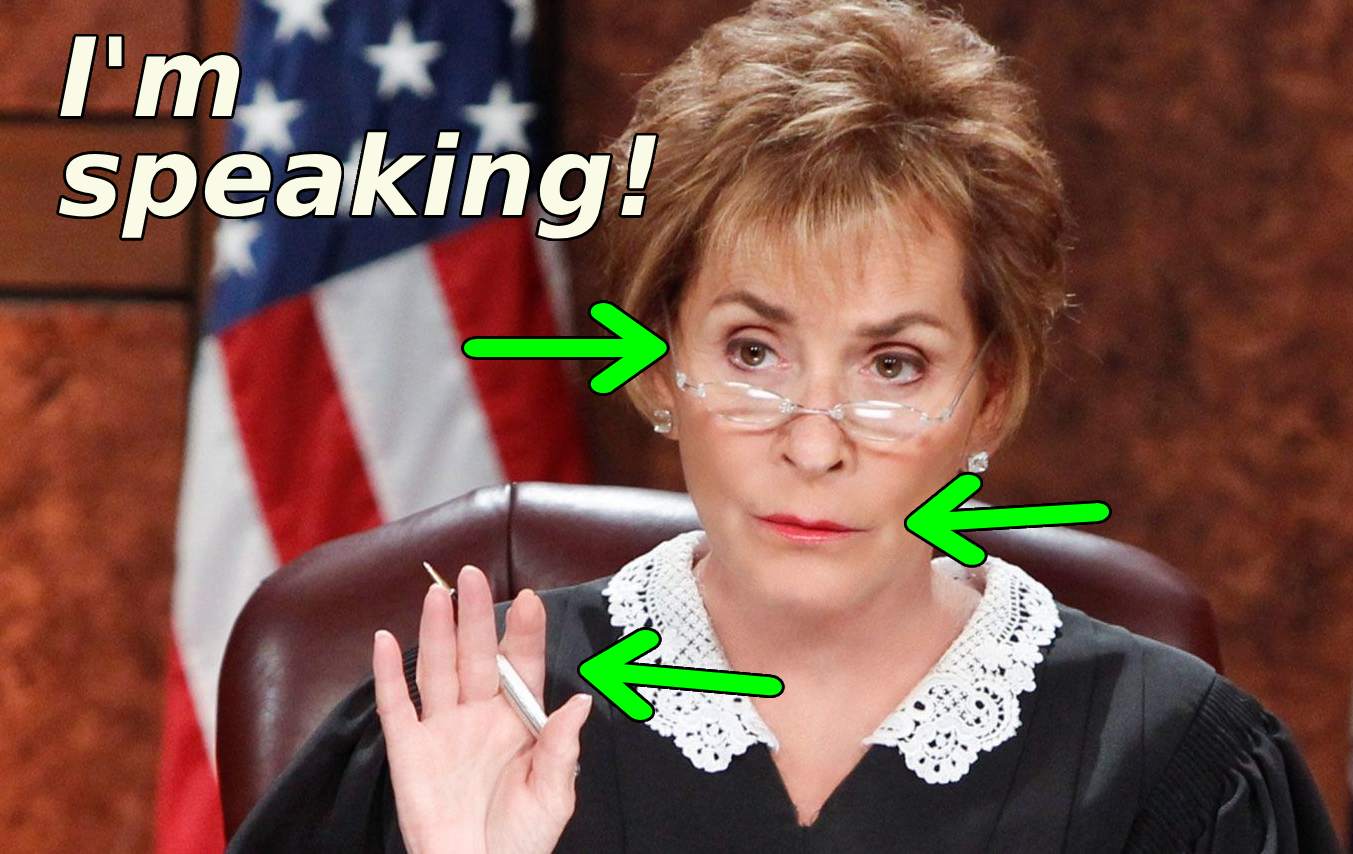 judge judy raises her hand to get attention and defend her speaking time as an example of enforcing boundaries